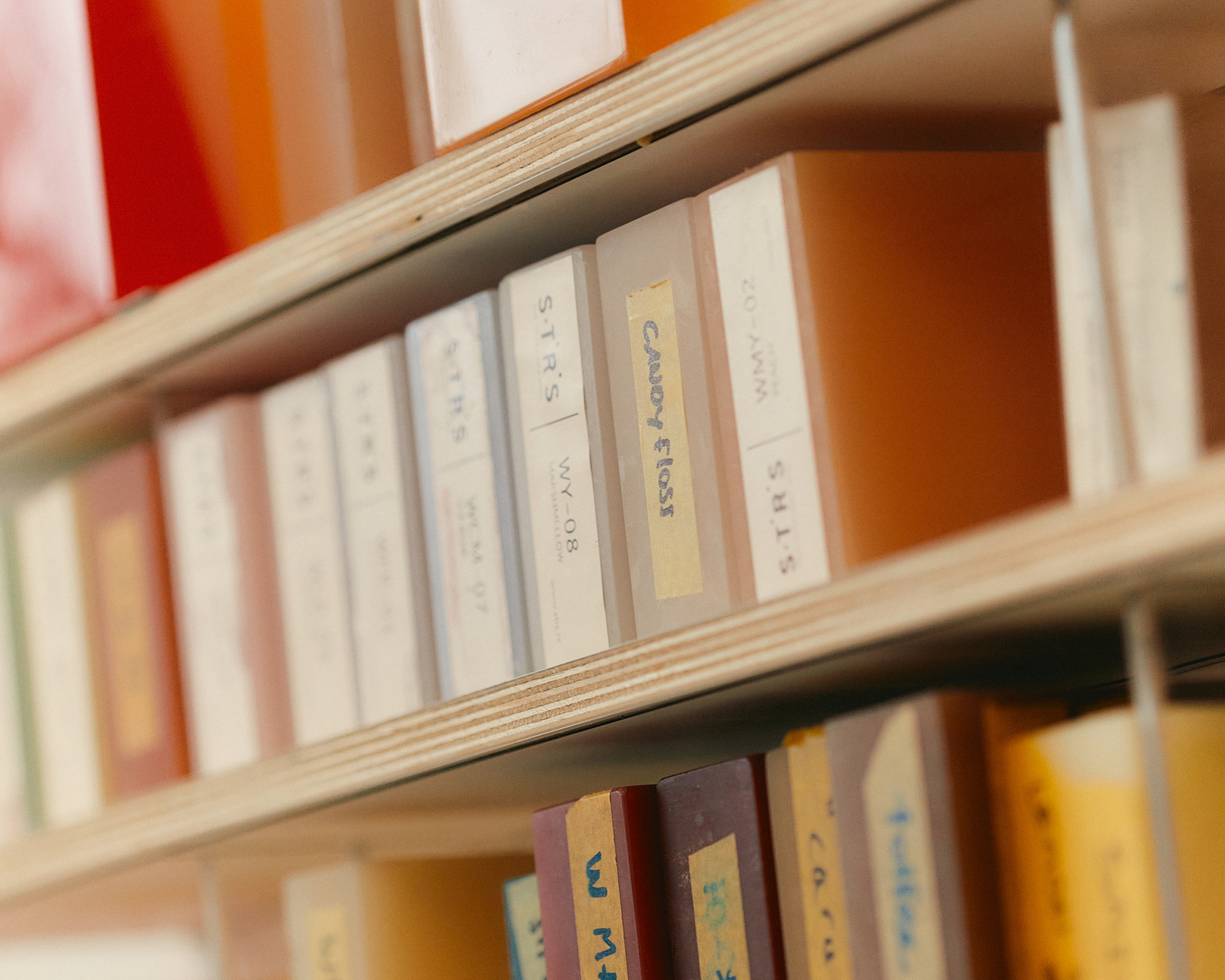 Shelf with color sample panels in various colors and labels
