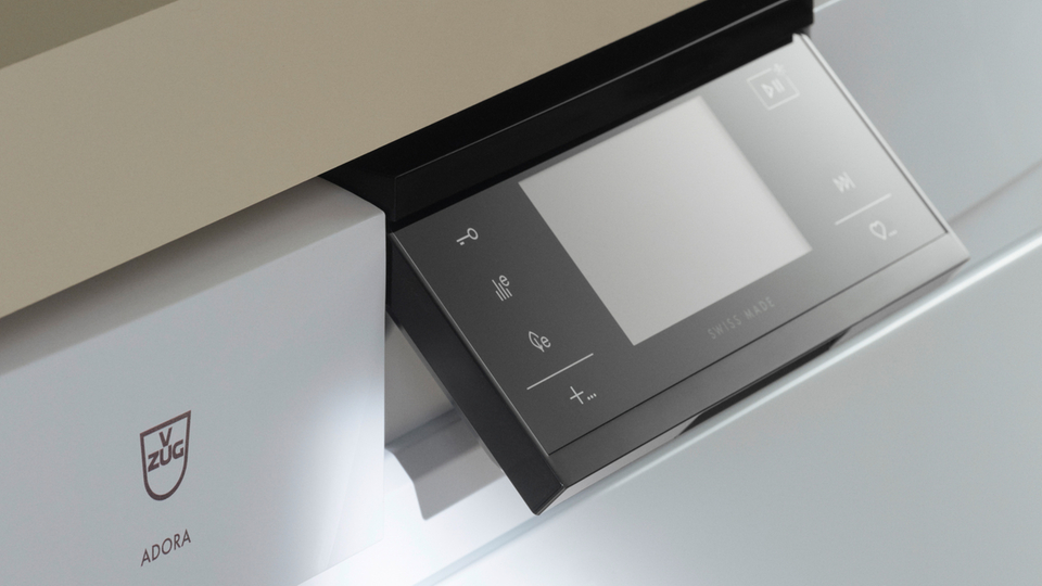 Close-up of a dishwasher control panel with touchscreen and modern design.