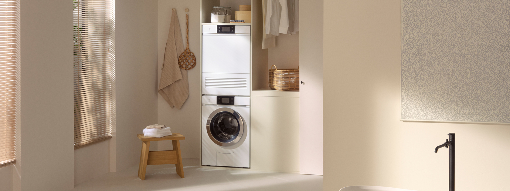 Washing machine and tumble dryer in a stylish, minimalist bathroom