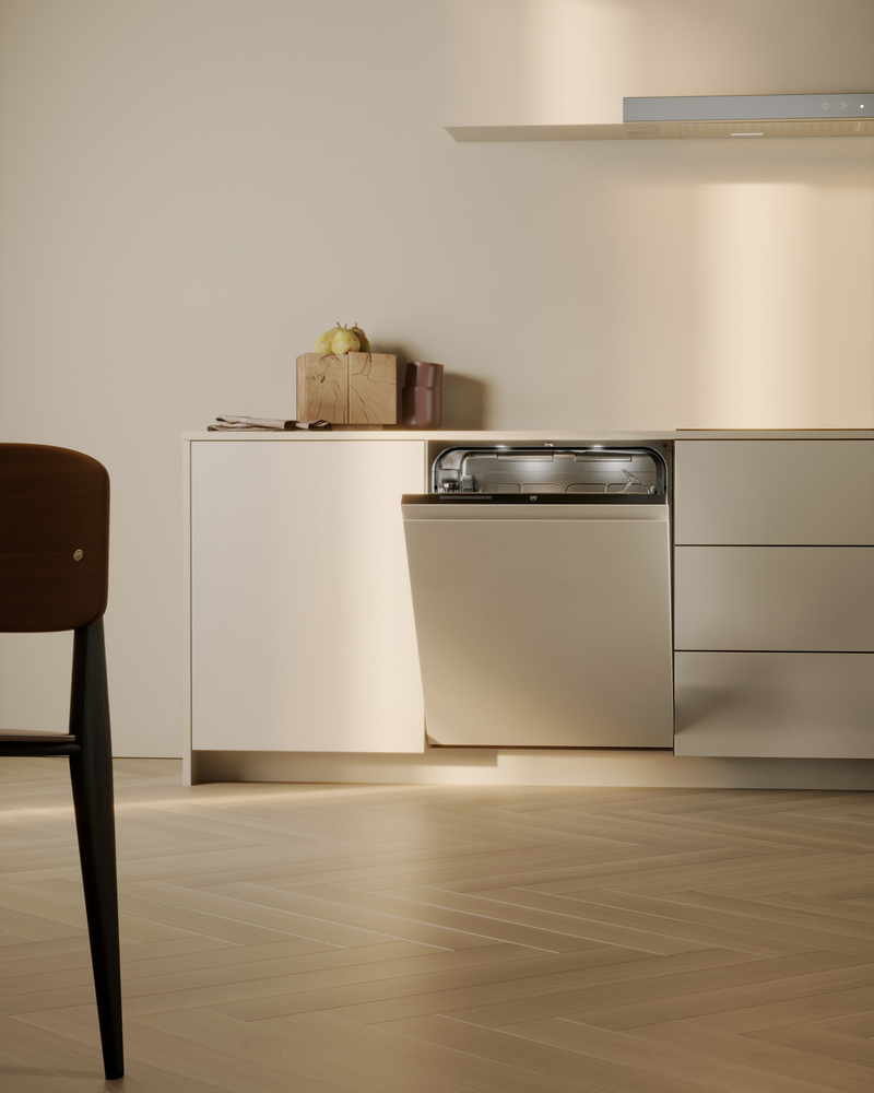 Modern dishwasher in an elegant kitchen with minimalist furnishings and warm lighting.