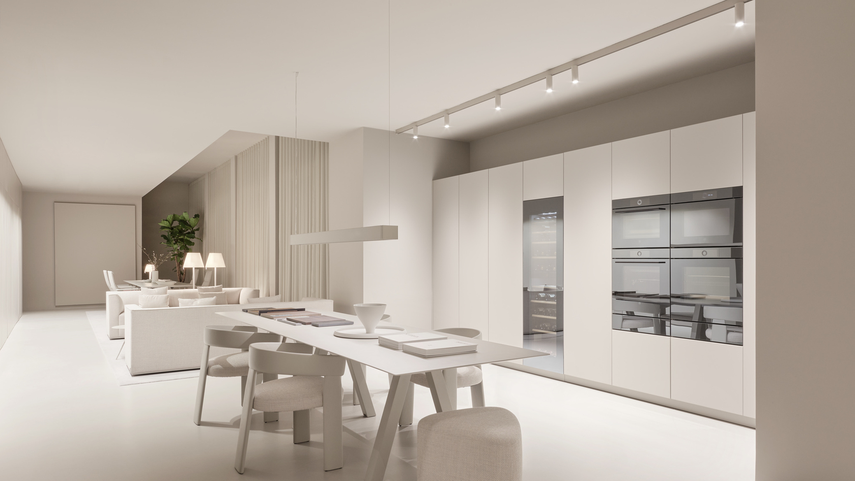 Cuisine moderne avec des appareils encastrés comme des fours et une armoire à vin au design minimaliste