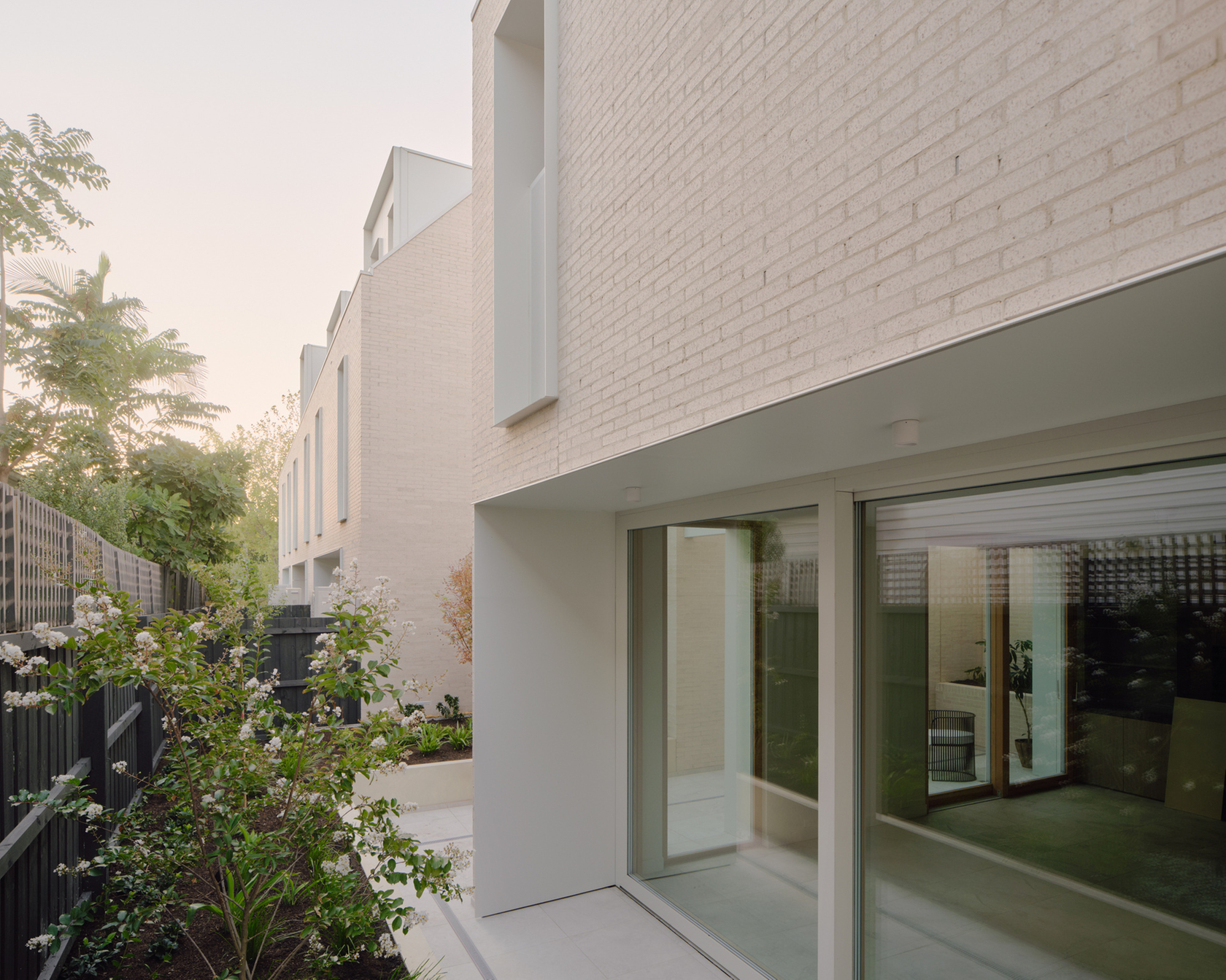 Modern residential architecture with large windows and garden view