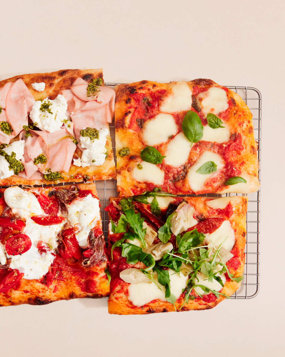 Pizza variations with fresh ingredients such as mozzarella, tomatoes and basil arranged on a grid.