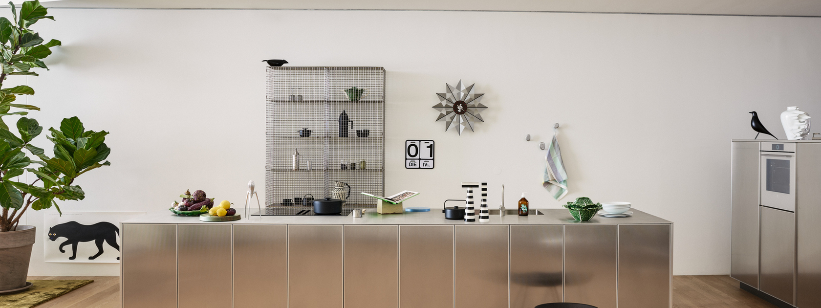 Modern kitchen with stainless steel island and minimalist furnishings