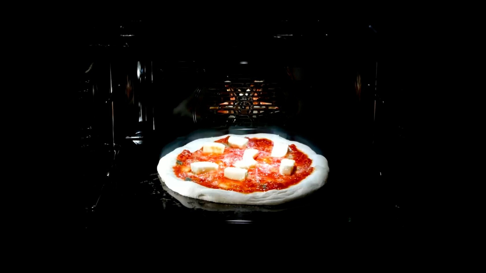 Pizza with tomato sauce and cheese baked in the oven