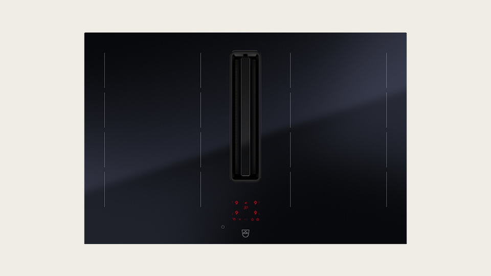 Black cooktop with integrated extractor fan for the kitchen