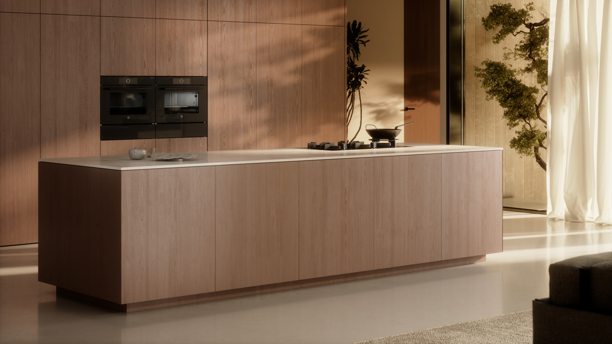 Modern kitchen with cooking island and built-in appliances in a minimalist design.