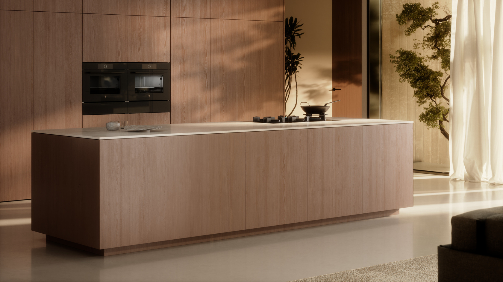Modern kitchen with cooking island and built-in appliances in a minimalist design.