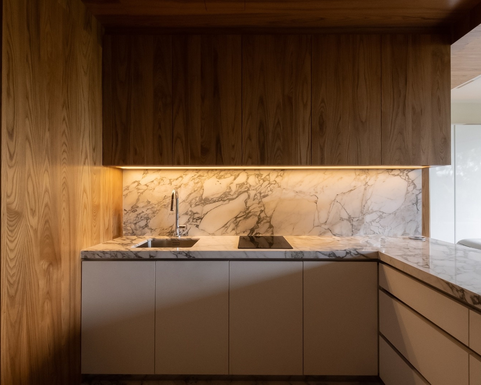 Modern kitchen with marble worktop and wood paneling
