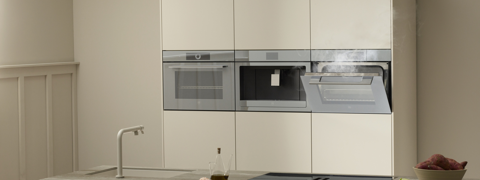 Modern kitchen with built-in oven and steamer in a minimalist design
