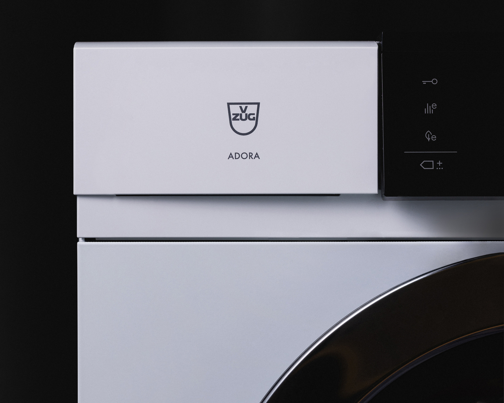Detailed view of the V-ZUG Adora washing machine with elegant design and focus on textile care.